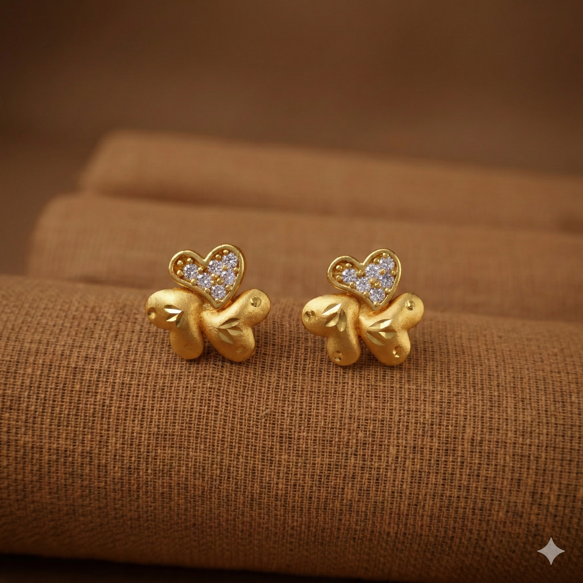 Elegant gold plated stud earrings featuring triple-petal floral design