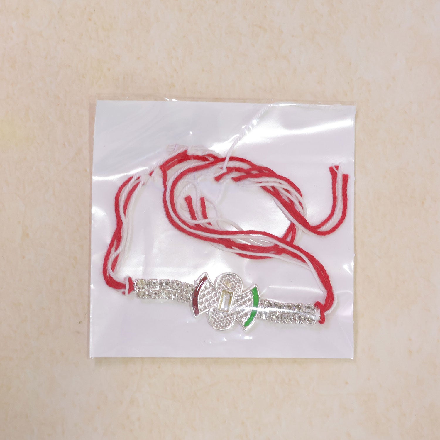 Elegant Rakhi with Butterfly Charm, color stones and wrist style for Festive Display