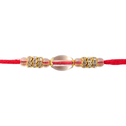Red Thread Rakhi with Oval Crystal Bead Pendant and Golden Finish