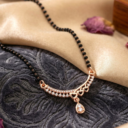 Elegant mangalsutra jewelry with intricate design and gemstone embellishments