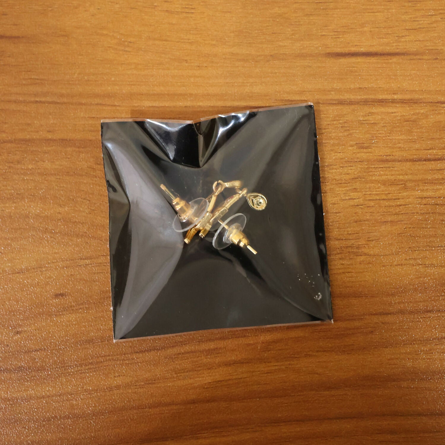 Luxury Curved Gold Earrings With Sparkling Stone Inlay And Elegant Drop Design