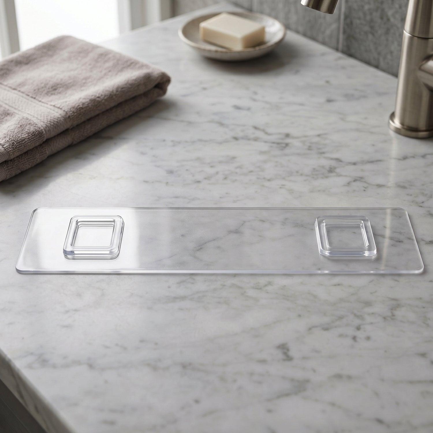 Detail of transparent bathroom shelf with three white hooks