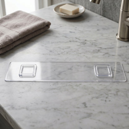 Detail of transparent bathroom shelf with three white hooks
