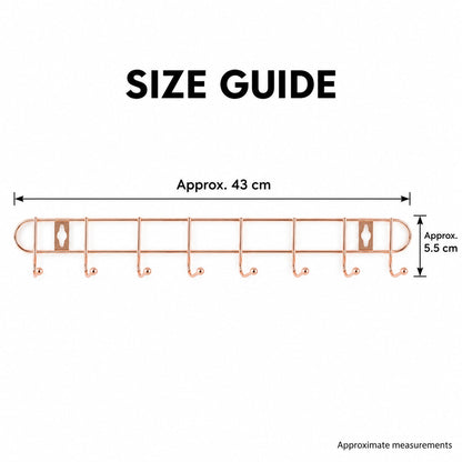 A rose gold metal wall hanger with eight hooks displays its dimensions, approximately 43 cm wide and 5.5 cm high.