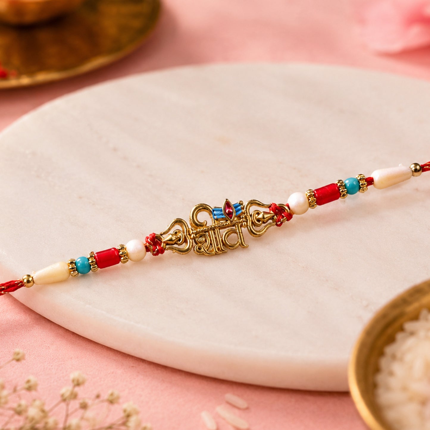 Shiv Script Pendant Rakhi with Blue Trishul Accent and Pearl Beads