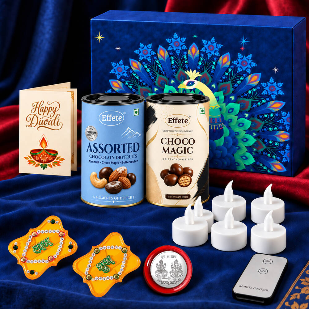 A blue box with a peacock design, two chocolate tins, a Diwali card, six white LED tealights, a remote, two yellow Shubh