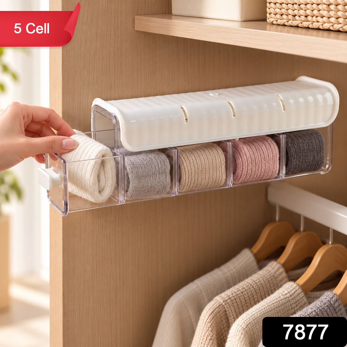 A hand pulls out a clear drawer from a white organizer, showing neatly rolled socks in different shades.