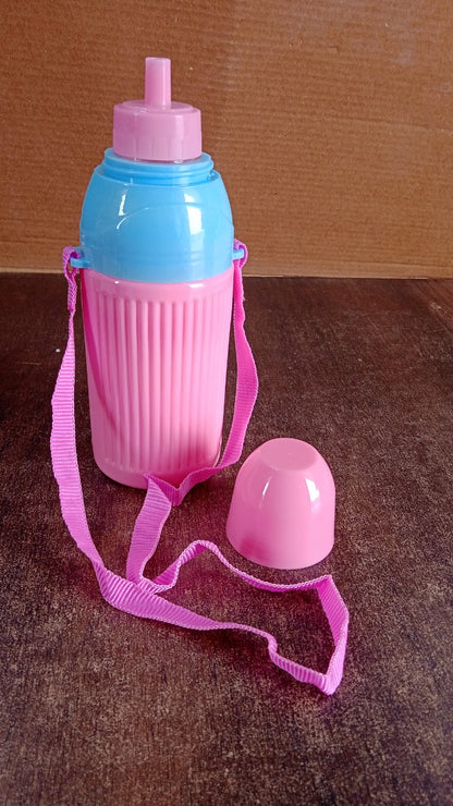 Water bottle hanging by dori strap for outdoor use