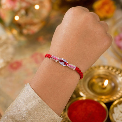 Red Thread Rakhi with Pink and Clear Crystal Bead Pendant Accents