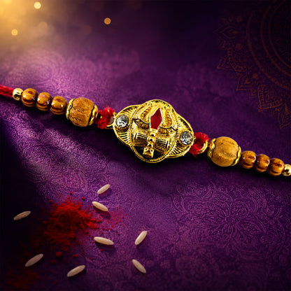 Tilak Trishul Golden Devotional Rakhi with Wooden Beads and Traditional Red Thread
