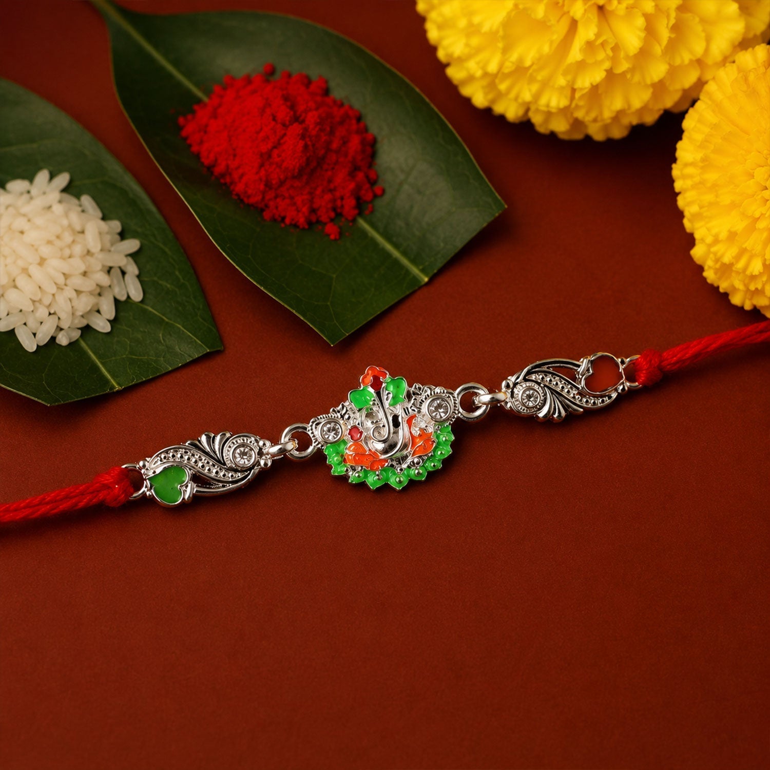 Rakhi Elegant Silver Ganesh Charm with Red Dori for Brother (10pcs)