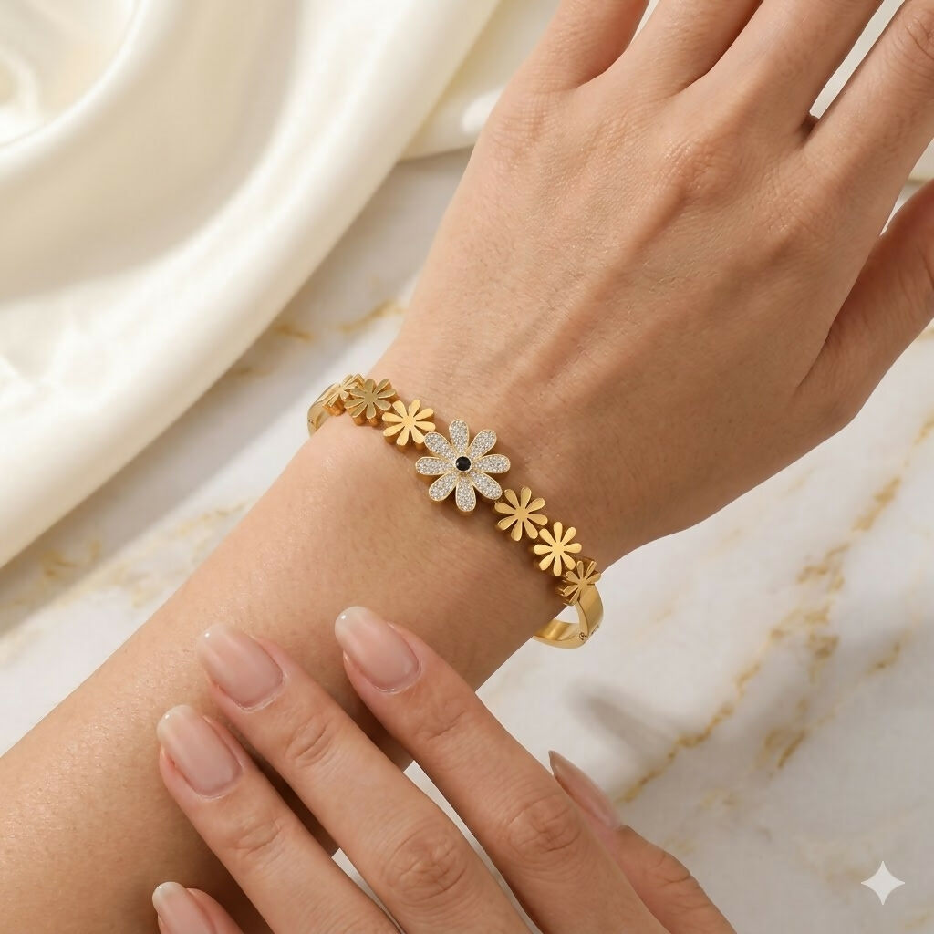 Side view of linked and solid bangle botanical kada bracelet