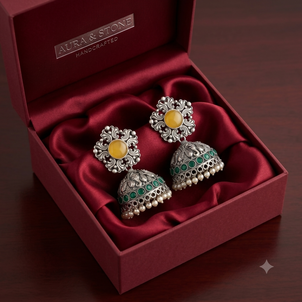 Side view of oxidised silver jhumka earrings with pearl drops
