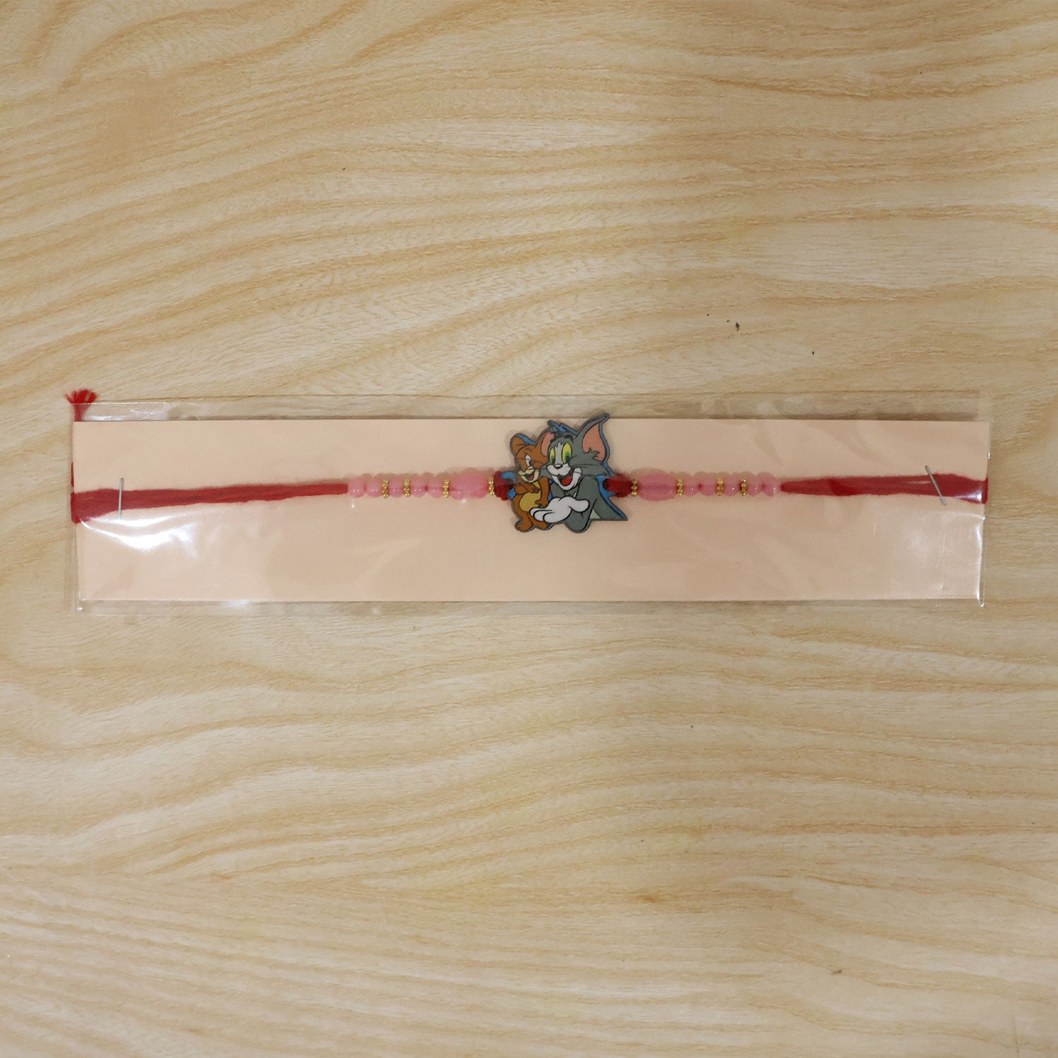 Tom Jerry Cartoon Rakhi with Pink Beads and Sweet Kids Look