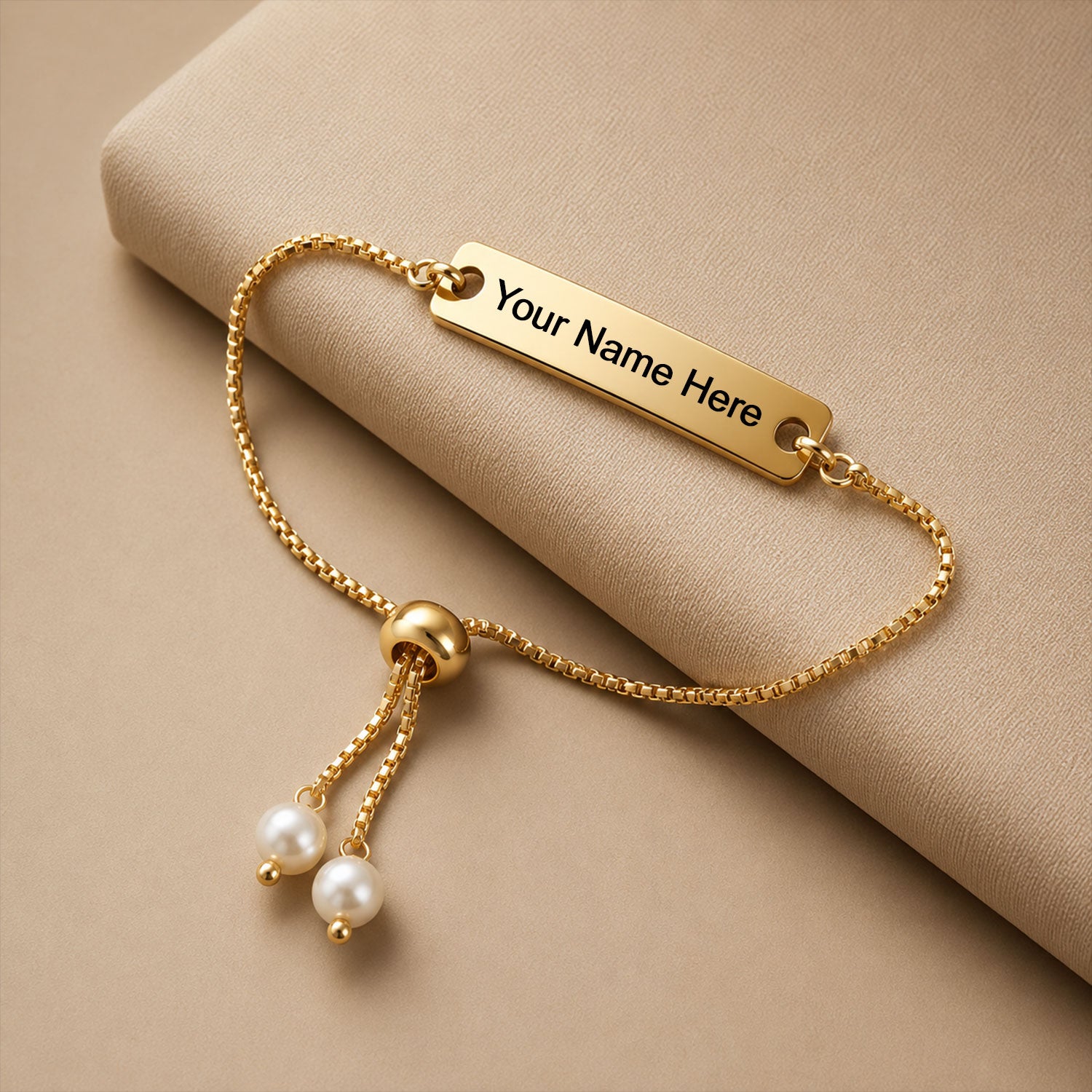 Custom name bracelet with adjustable gold-tone chain and delicate pearl beads.