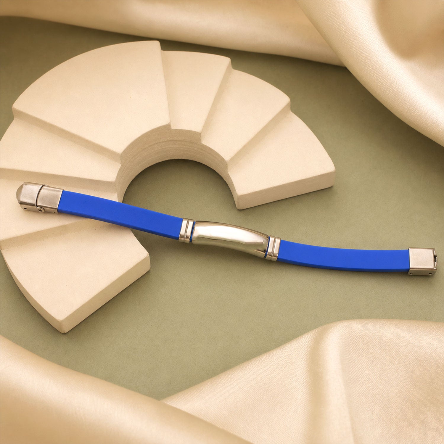 Detail shot of the durable silicone band and polished metal elements of the wrist bracelet.