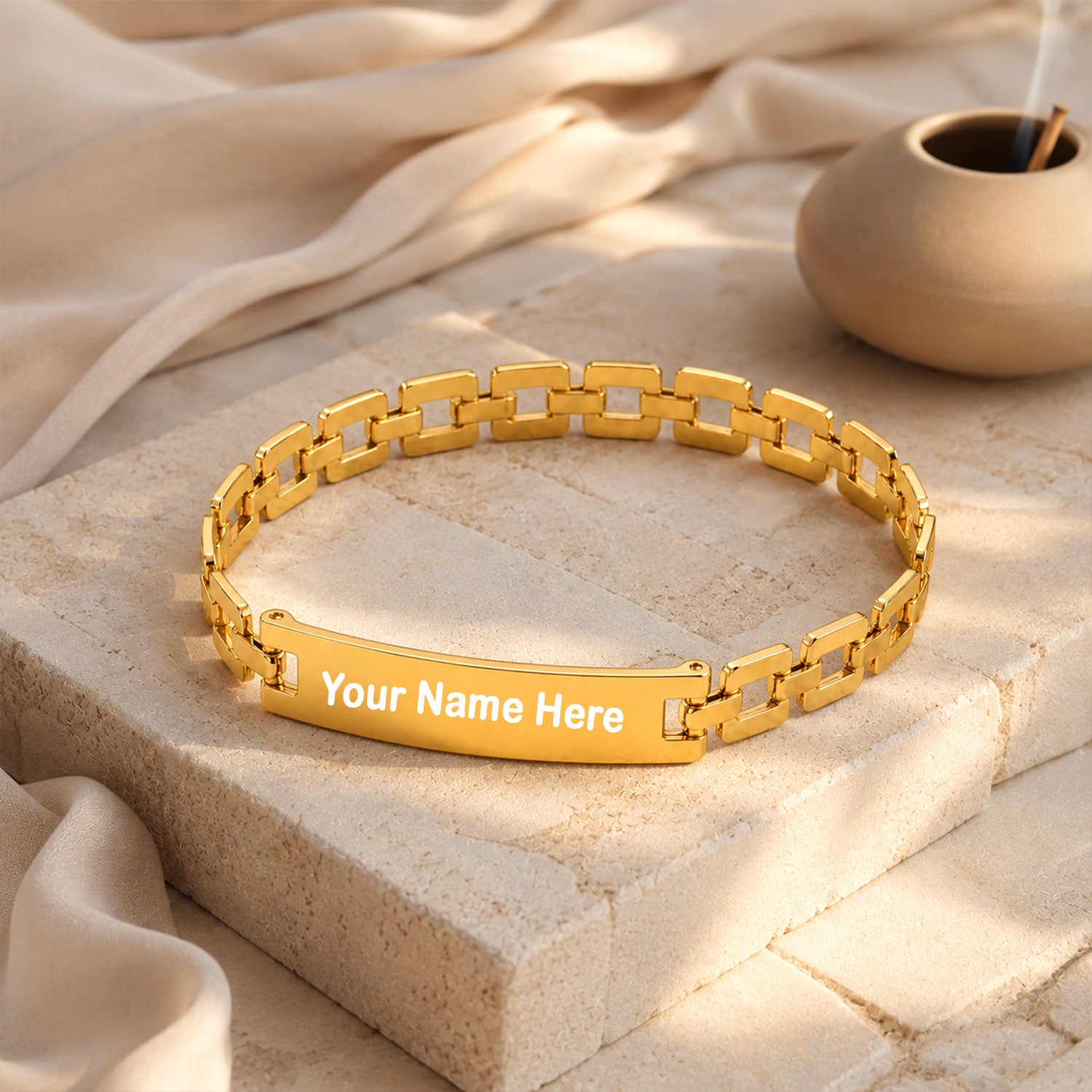 Gold-plated personalized name bracelet worn on a wrist, showcasing its elegant design.