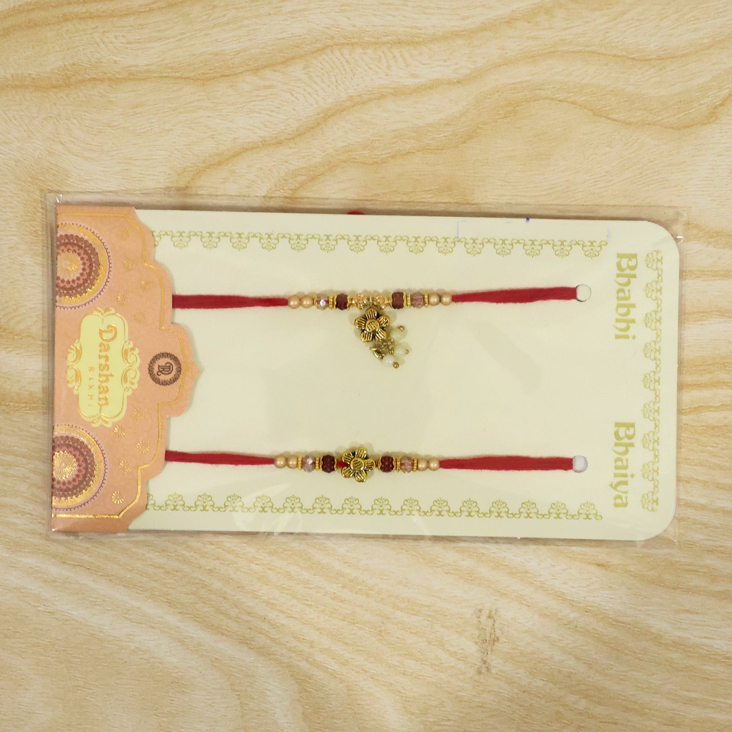 Divine Floral Motif Design Bhai Bhabhi Rakhi with Flower and Pearl Drop for Gifting