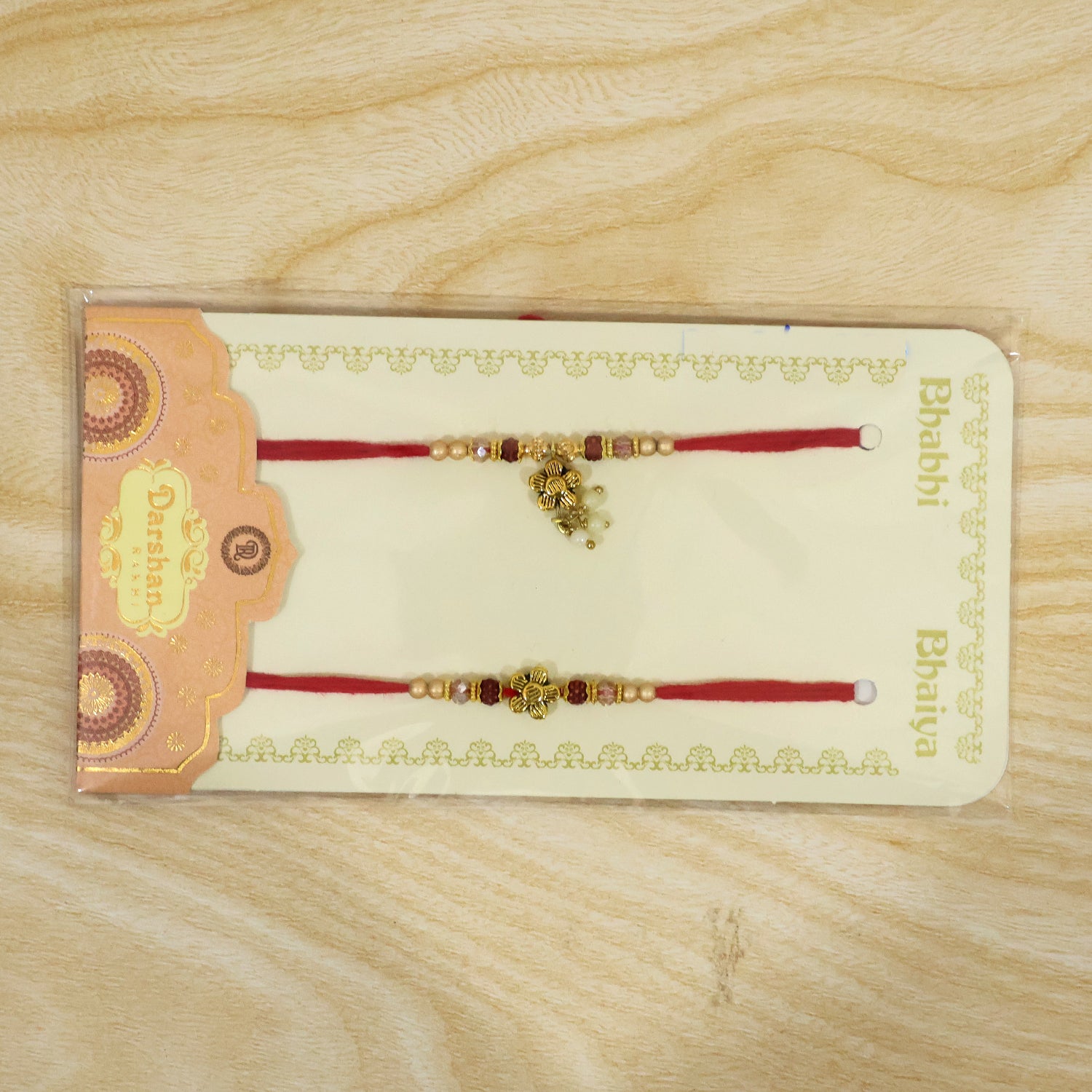 Divine Floral Motif Design Bhai Bhabhi Rakhi with Flower and Pearl Drop for Gifting