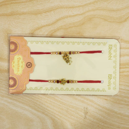 Divine Floral Motif Design Bhai Bhabhi Rakhi with Flower and Pearl Drop for Gifting