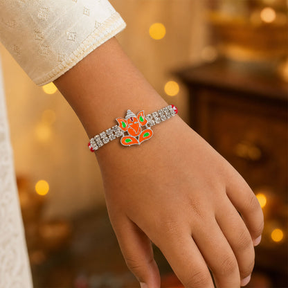 Silver-Toned Lord Ganesha Rakhi with Orange-Green Enamel, Double Crystal Chain & Red Thread