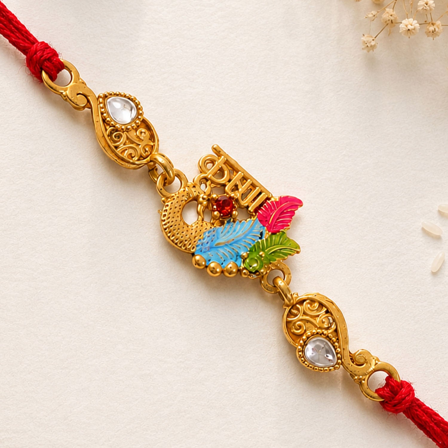 Designer Rakhi with Decorative Floral Medallion, gold trims and chain look for Gift