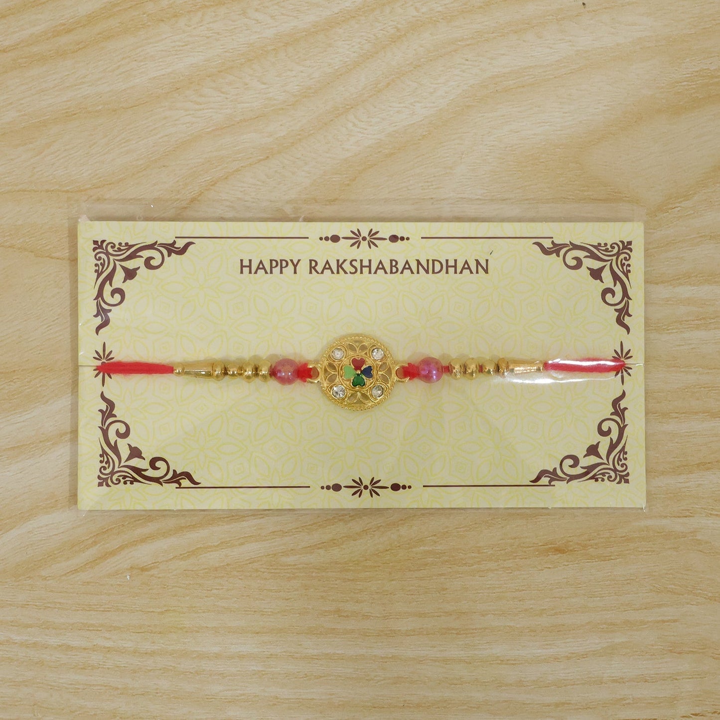 Festive Four-Petal Rakhi with Bright Enamel, Clear Stones and Translucent Beads (10pcs)