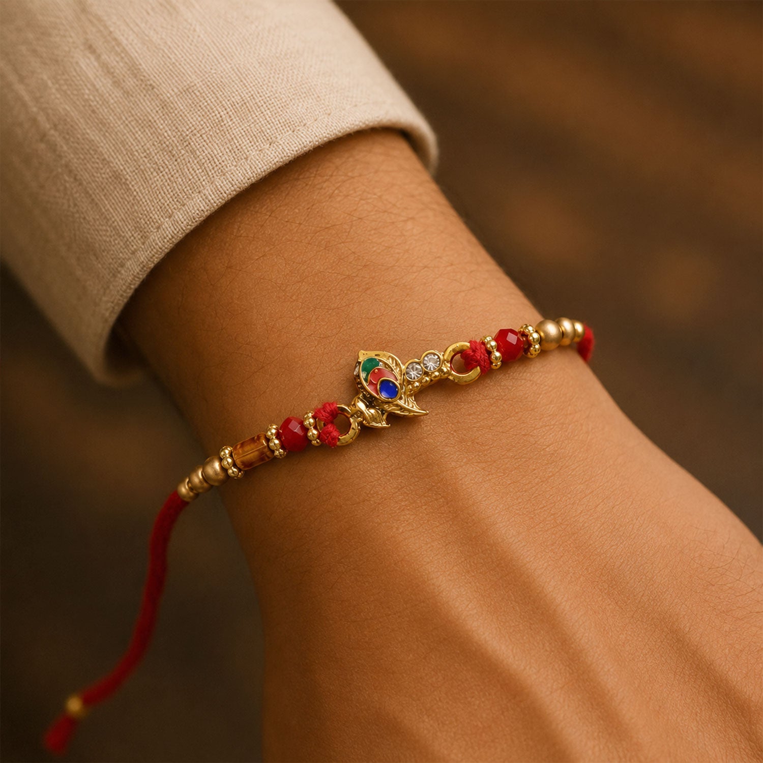 Peacock Floral Crescent Rakhi with Antique Gold Centre, Color Stones and Red Thread
