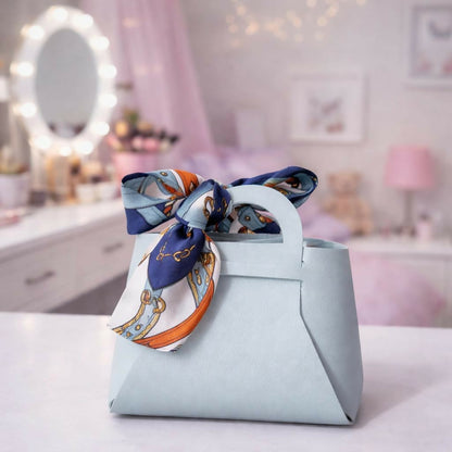 Front view of blue handbag organizer with bow detail