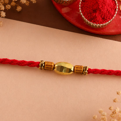 Red Thread Rakhi with Golden Oval Bead and Wooden Bead Accents