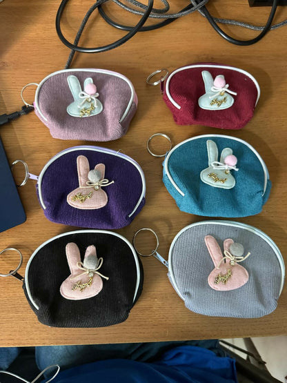 Mini bunny coin pouch with keychain displayed on white background