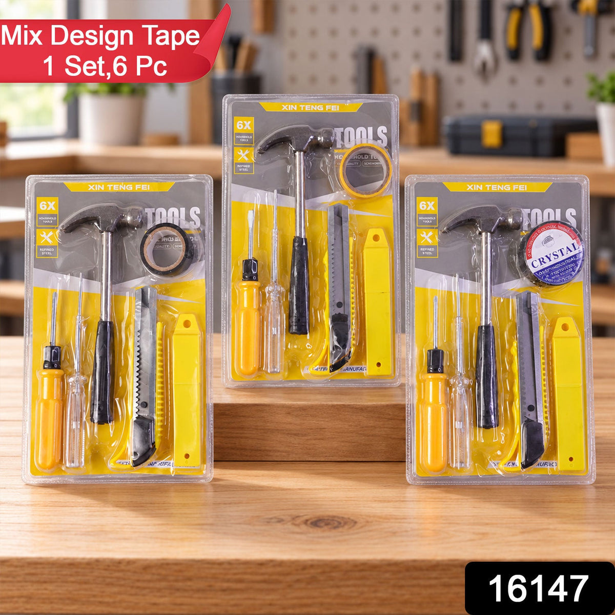 Three identical 6-in-1 household tool kits, each sealed in clear plastic, are displayed on a light brown wooden tabletop.