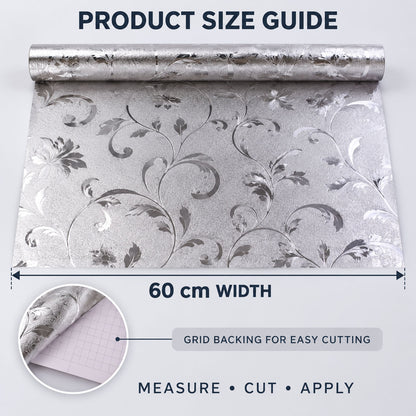 Unrolled silver floral wallpaper displaying a 60 cm width measurement and a close-up of the grid backing for cutting.
