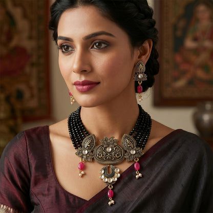 Close-up of black beaded necklace and earrings