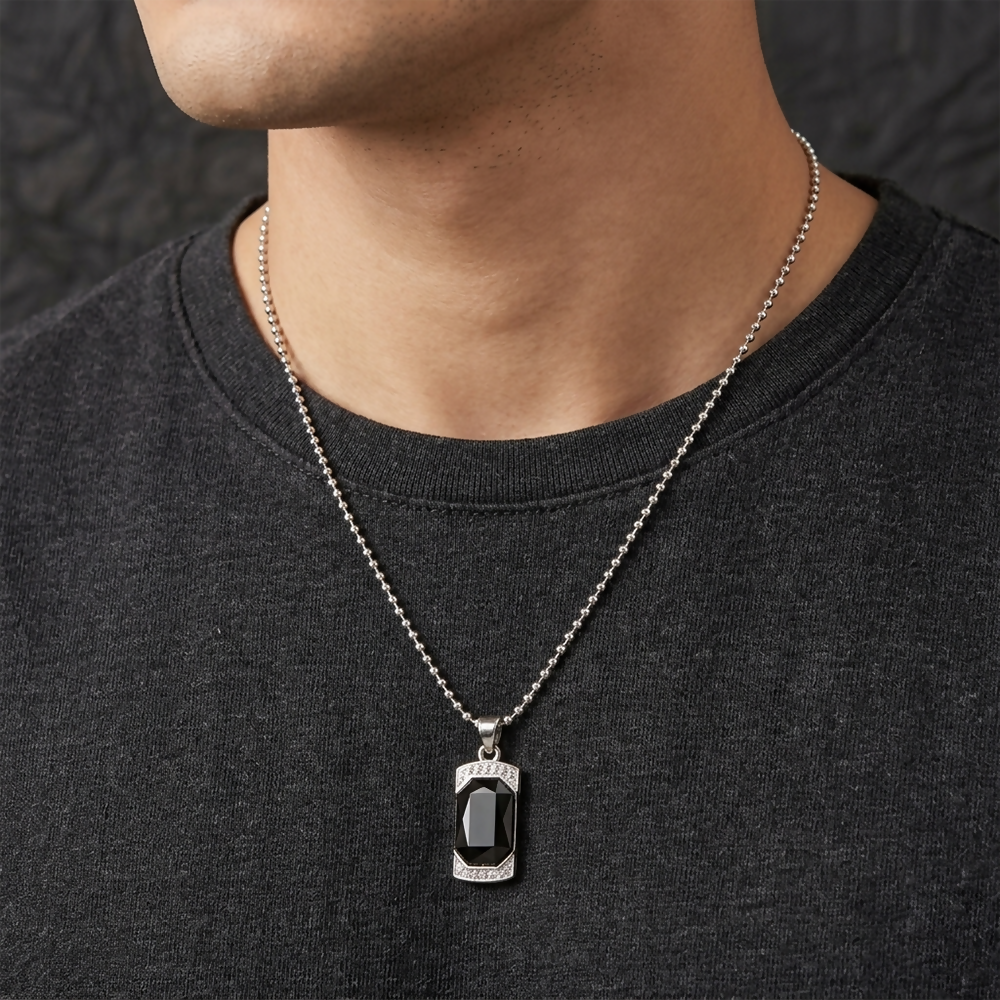 Close-up view of black onyx pendant with crystal frame and stylish chain
