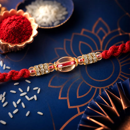 Red Twisted Cord Rakhi with Crystal Bead and Golden Accents