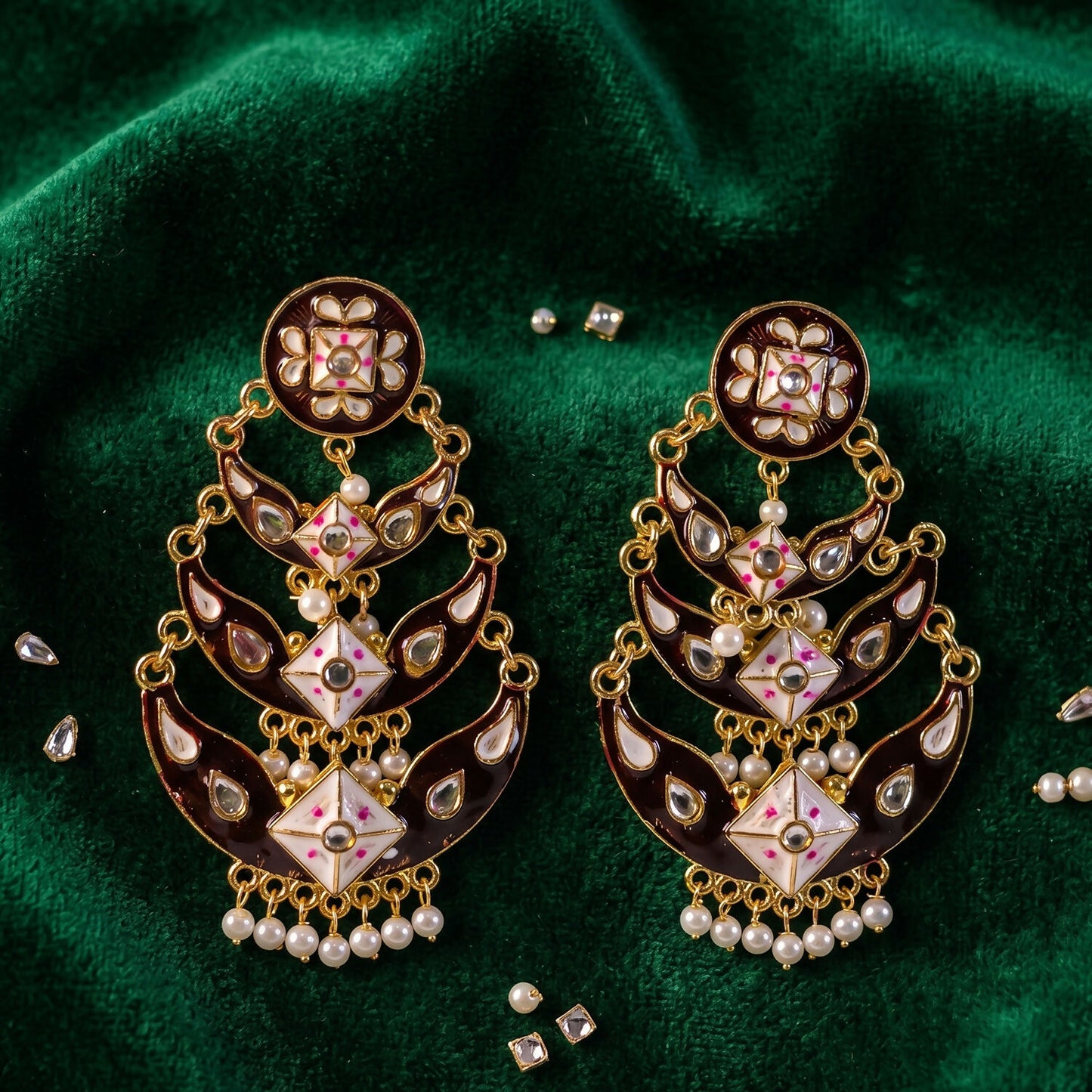Black meenakari earring showcasing layered artistic design