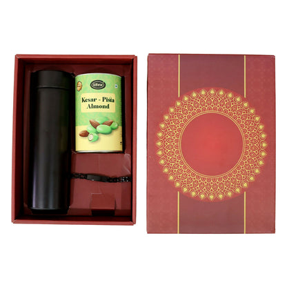 Gift set including rakhi, chocolate, and bottle