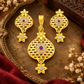 Traditional Golden-Plated Floral Mesh Pendant and Earrings Set with Ruby and CZ Stones