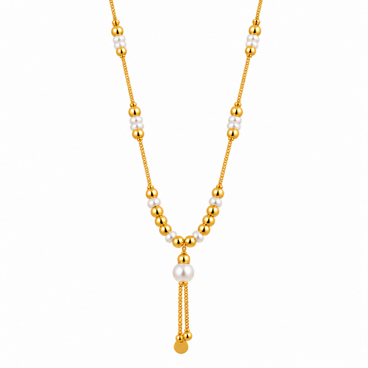 A gold tone necklace with white pearls and gold beads on a plain white background.