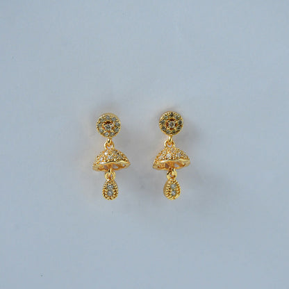 Elegant gold-tone dome earrings with floral crystal studs and teardrop charm on white background