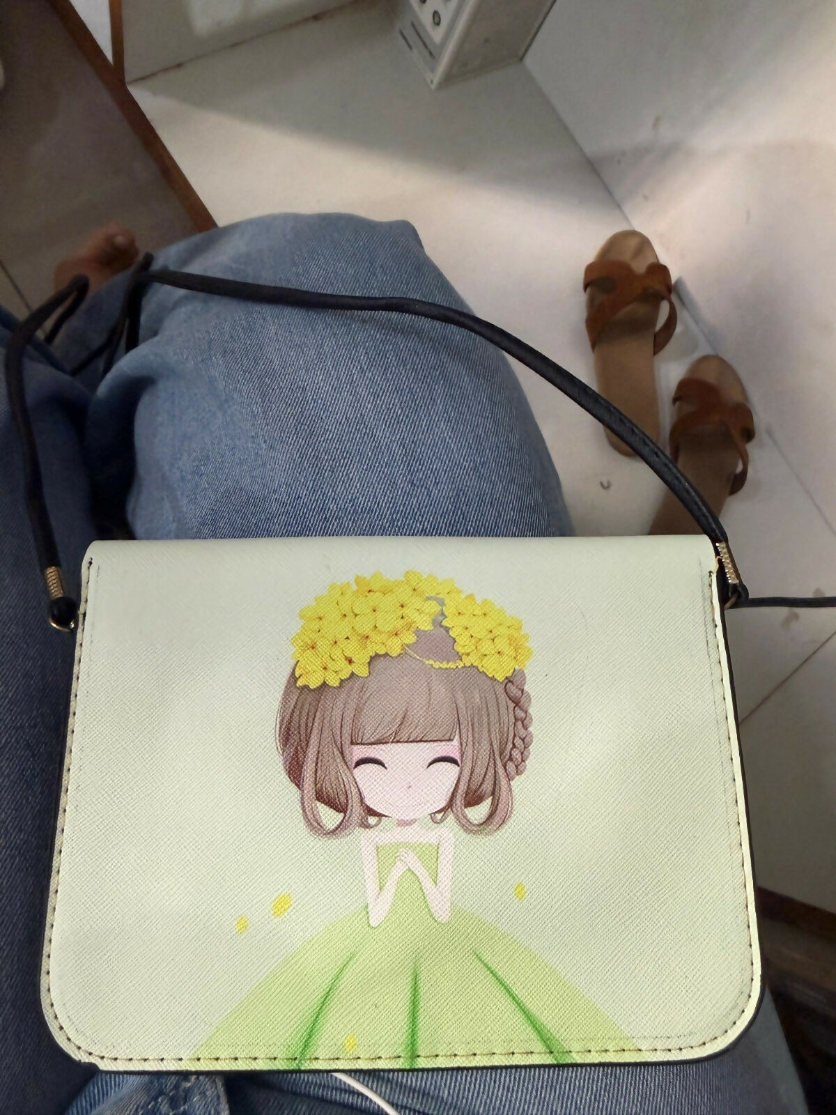 Green mini handbag worn across shoulder