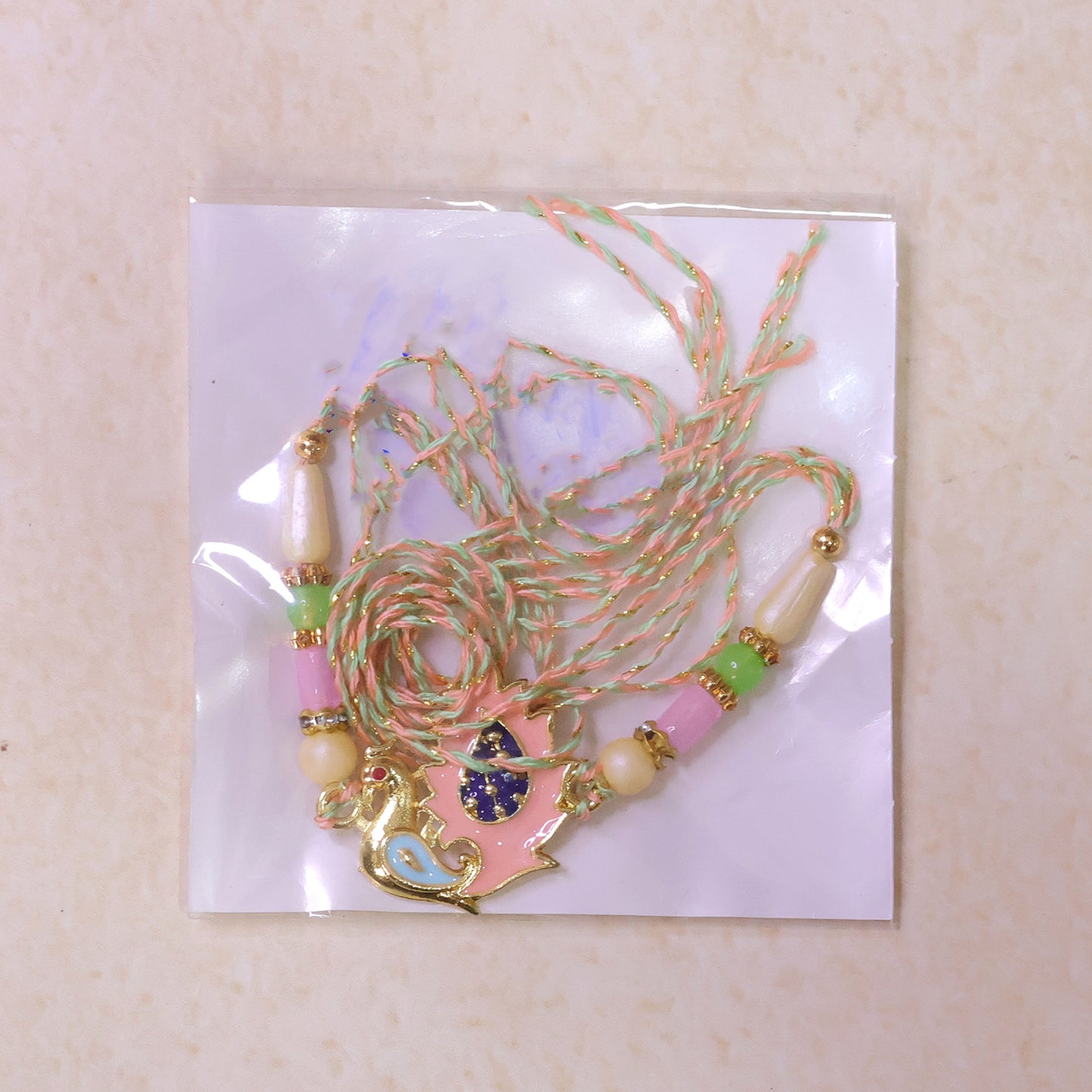 Peacock Designer Rakhi for Brother with Pink Pendant & Colorful Bead Work