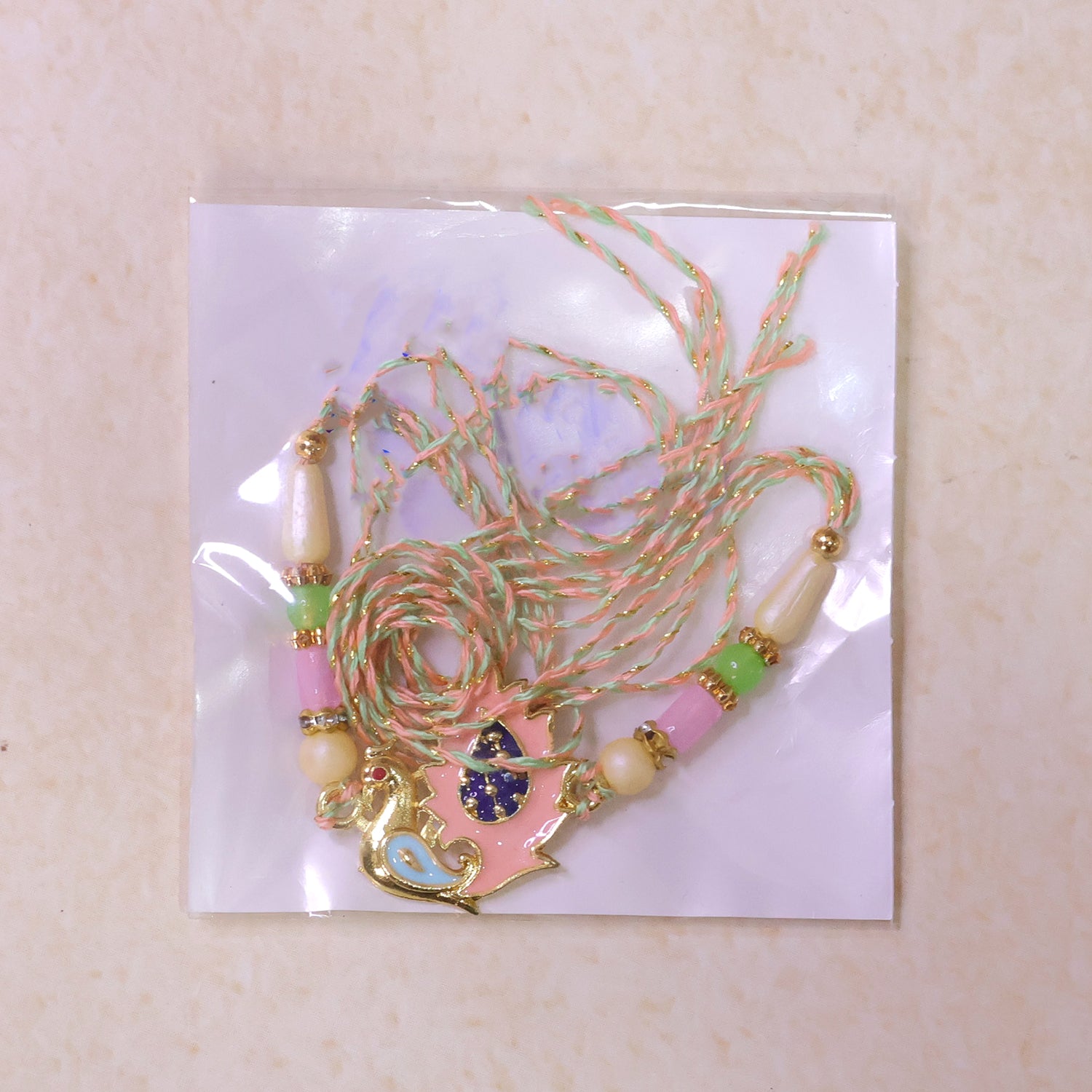 Peacock Designer Rakhi for Brother with Pink Pendant & Colorful Bead Work