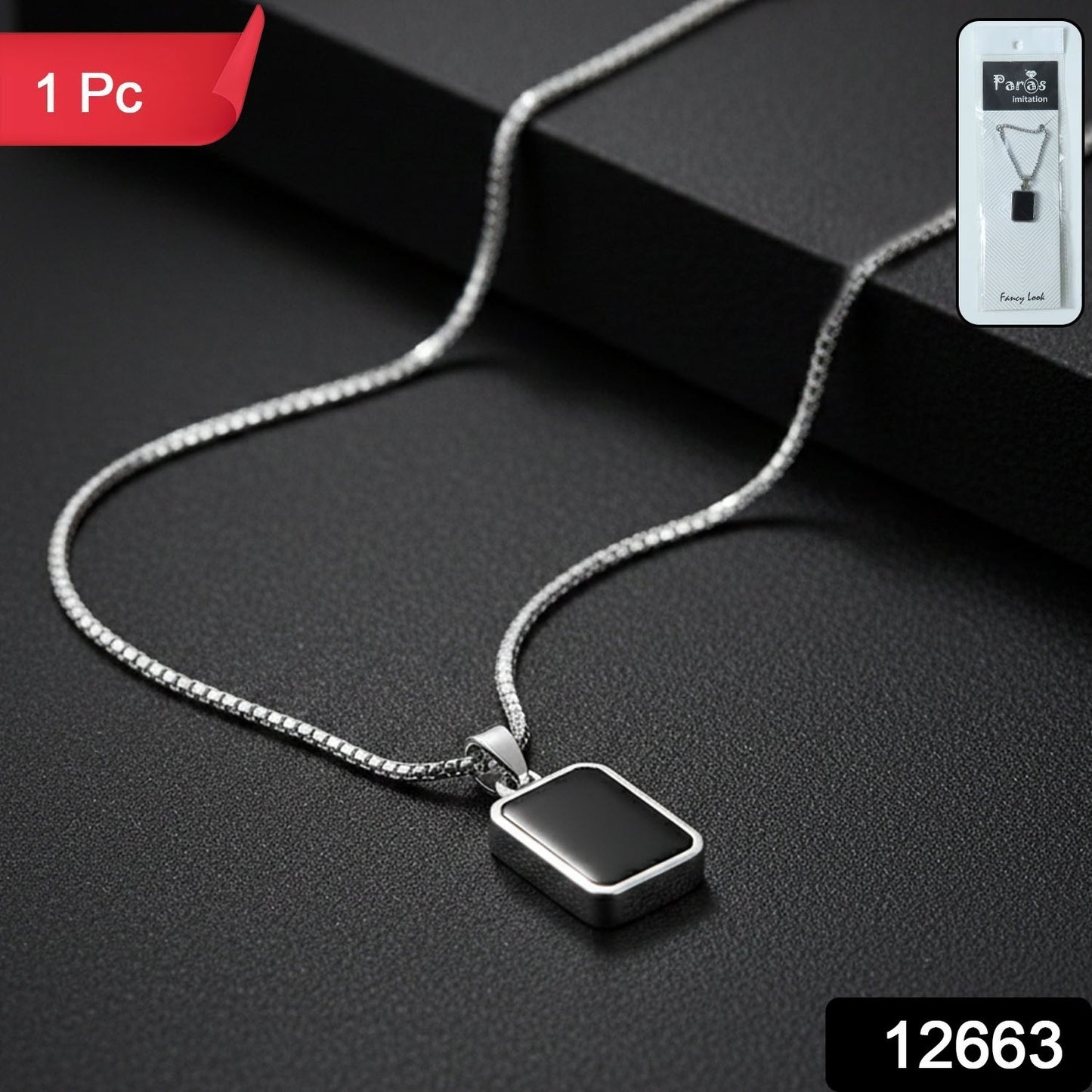 Close-up of black rectangular pendant on men's stainless-steel chain
