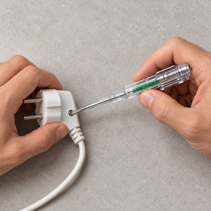 Hands hold a white electrical plug and a transparent tester screwdriver, checking a connection.