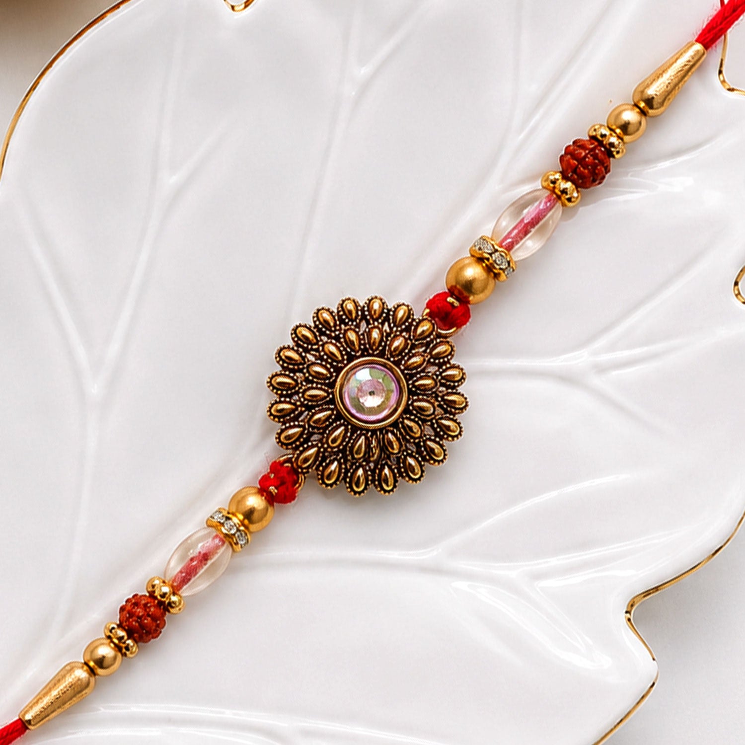 Oxidized Gold Floral Sunburst Pendant Rakhi with Rudraksha and Pearl Beads
