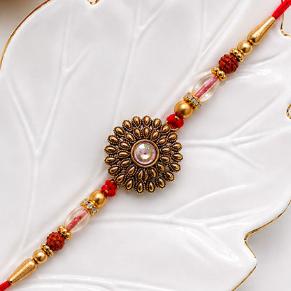 Oxidized Gold Floral Sunburst Pendant Rakhi with Rudraksha and Pearl Beads
