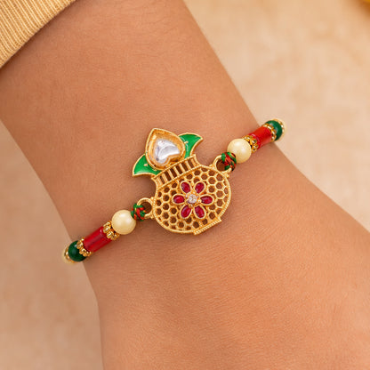 Classic Rakhi featuring Kalash Charm and red stone accents in chain look for Gift Use