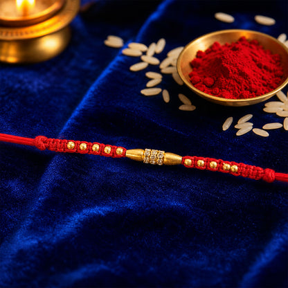 Minimal Red Thread Rakhi with Small Golden Bead Pendant Accents